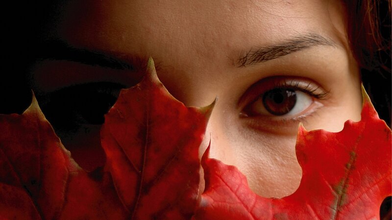 woman with red leaf