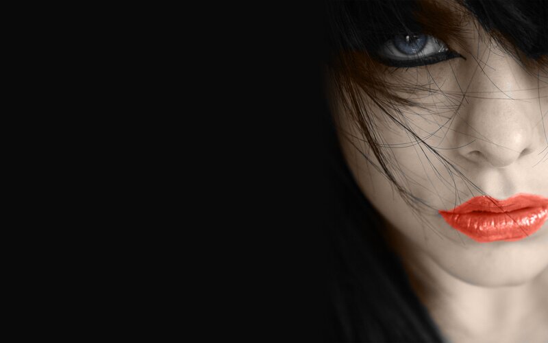woman with red lips and blue eyes