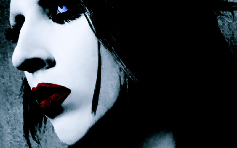 woman with red lips and blue eyes
