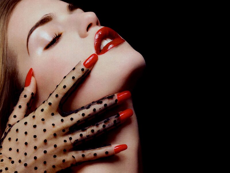 woman with red lips and gloves