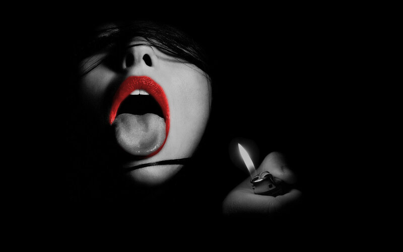 woman with red lips and lighter
