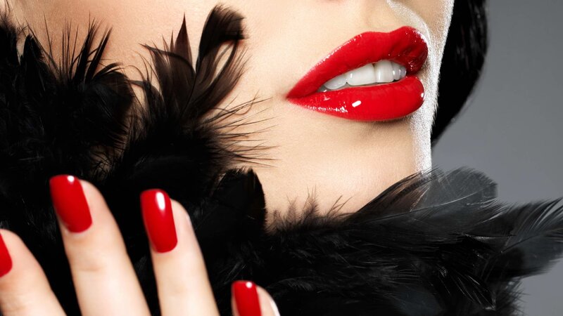 woman with red lips and nails