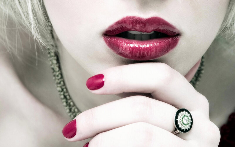 woman with red lips and ring