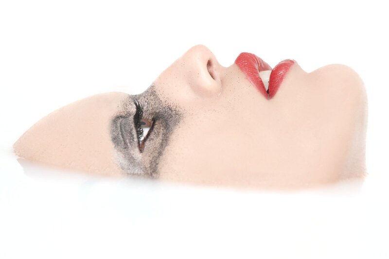 woman with red lips and smoky eye