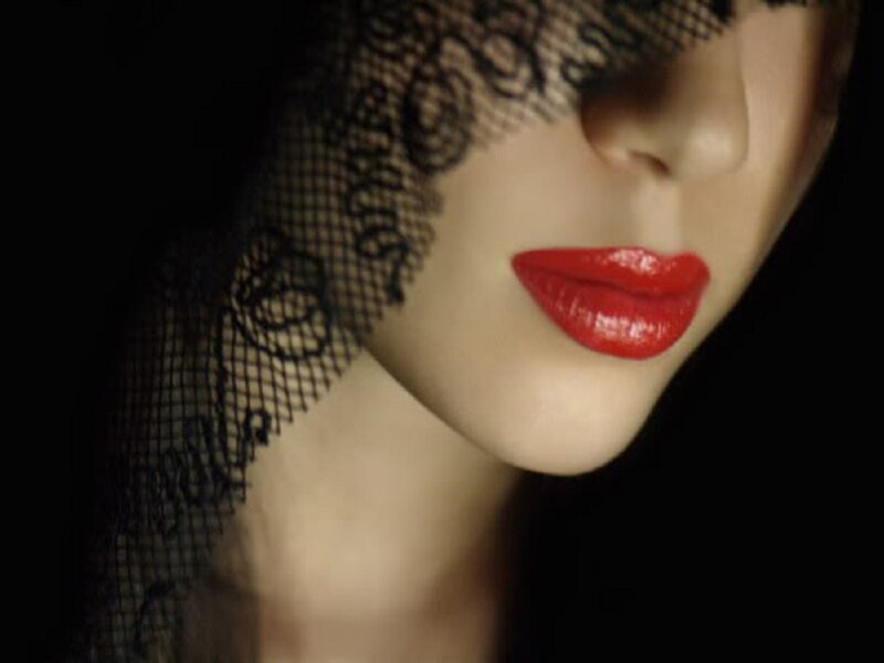 woman with red lips and veil