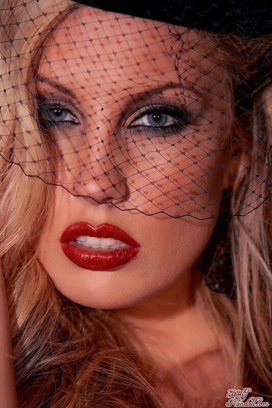 woman with red lips and veil