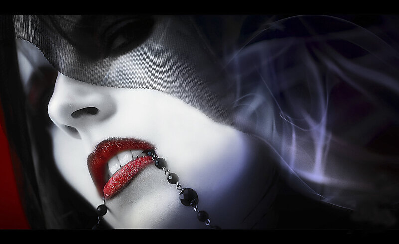 woman with red lips and veil