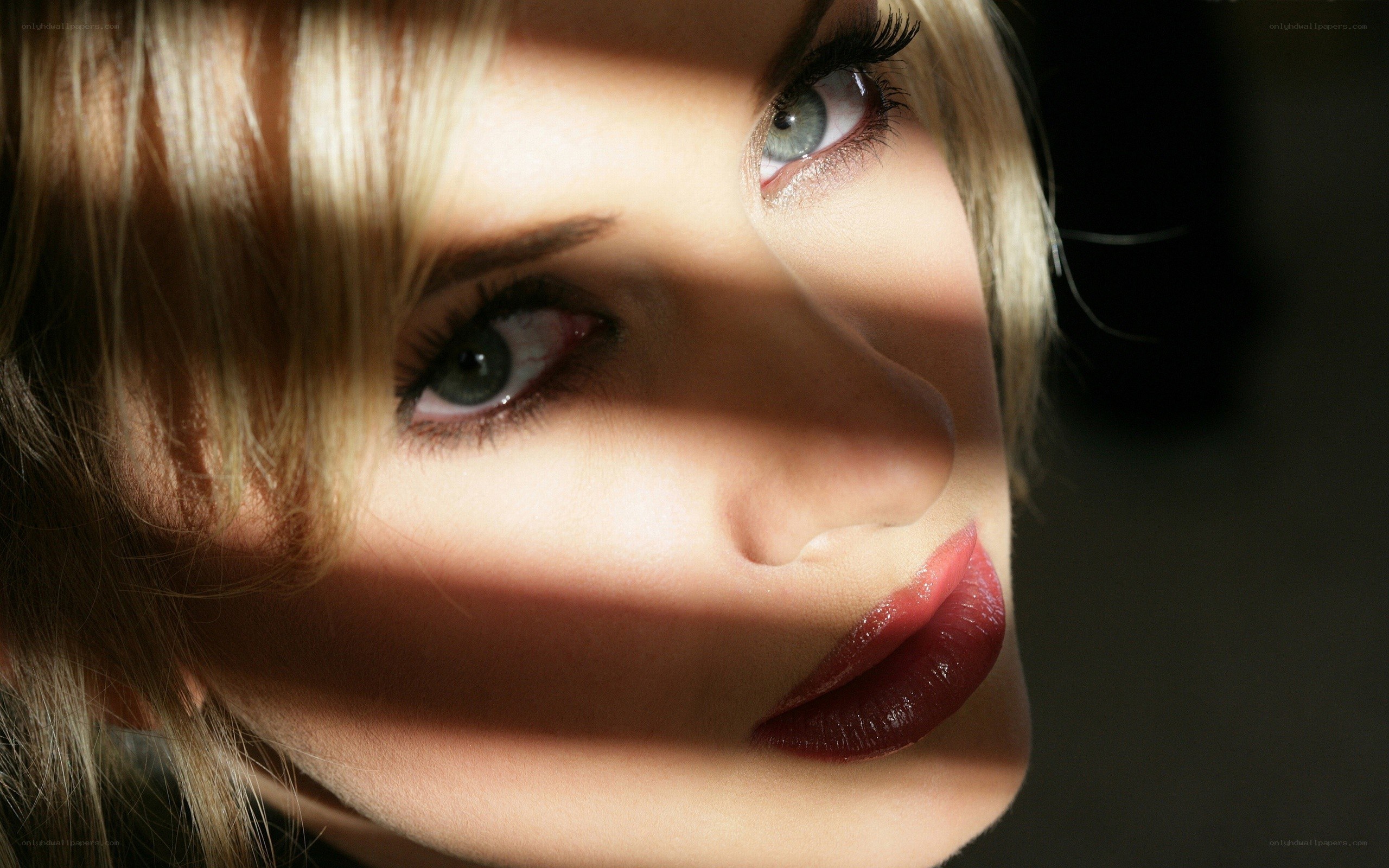 woman with red lips in shadow