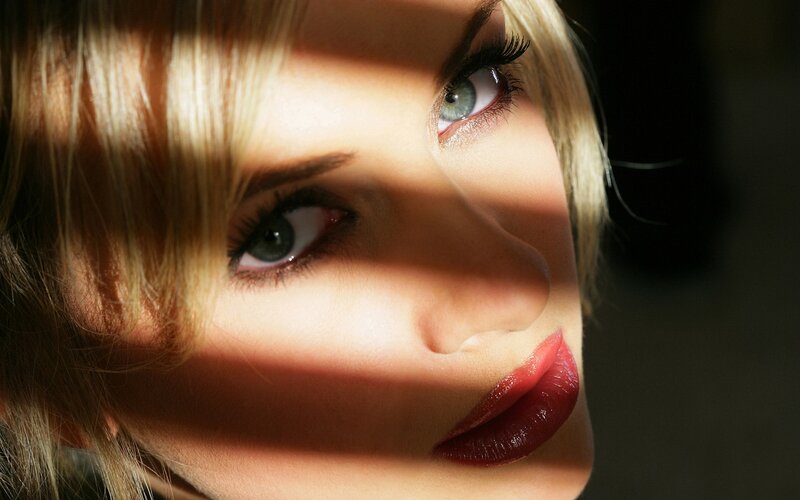 woman with red lips in sunlight