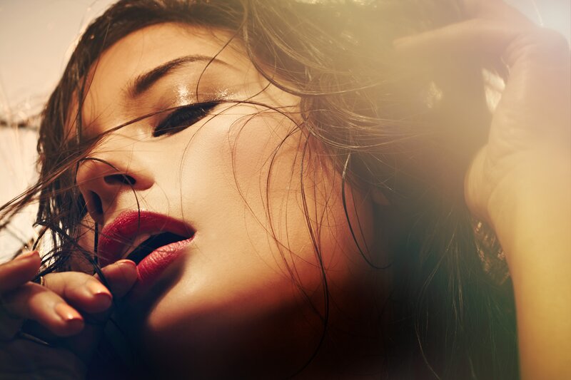 woman with red lips in sunlight