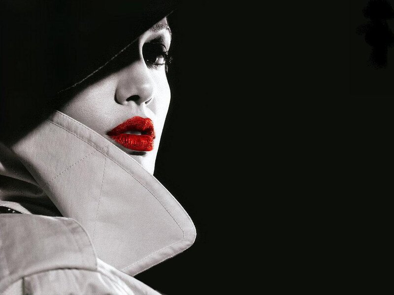woman with red lips in trench coat