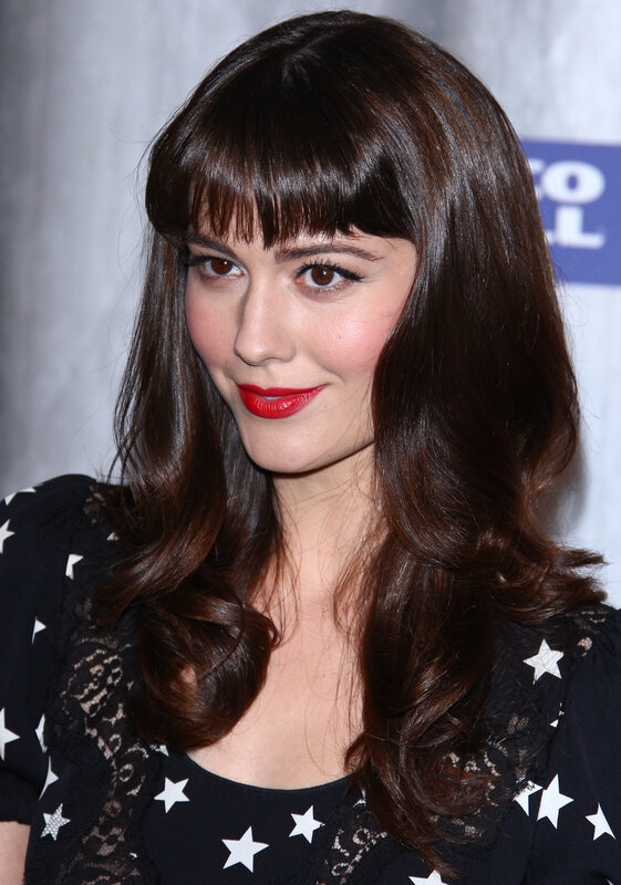 woman with red lipstick and bangs