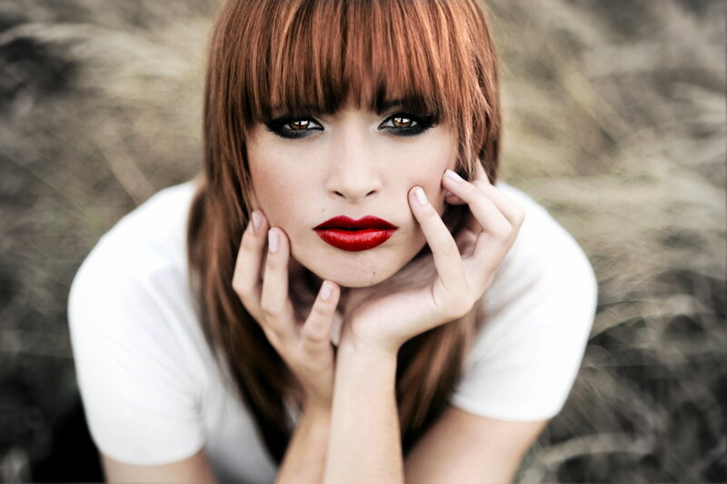 woman with red lipstick and bangs