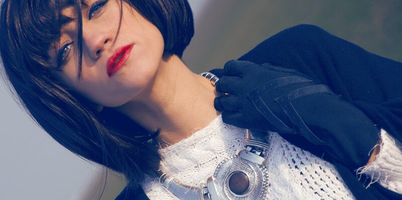 woman with red lipstick and black gloves