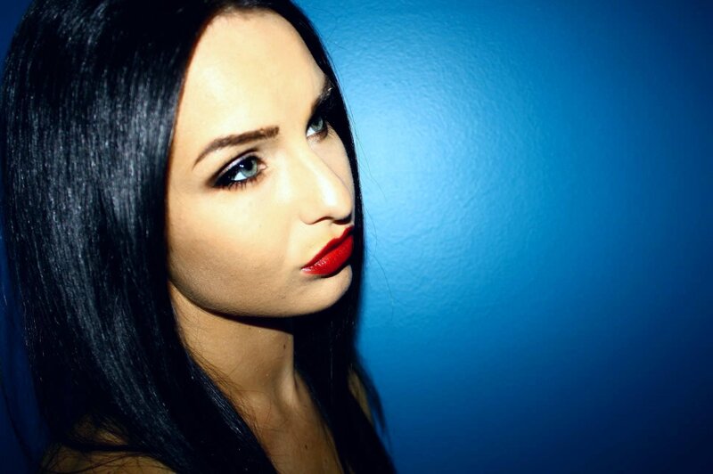woman with red lipstick and blue background