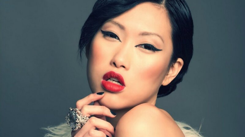 woman with red lipstick and bold makeup