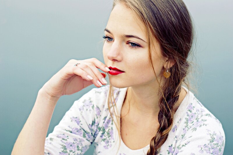 woman with red lipstick and braid