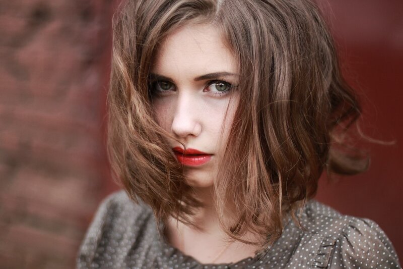 woman with red lipstick and brown hair