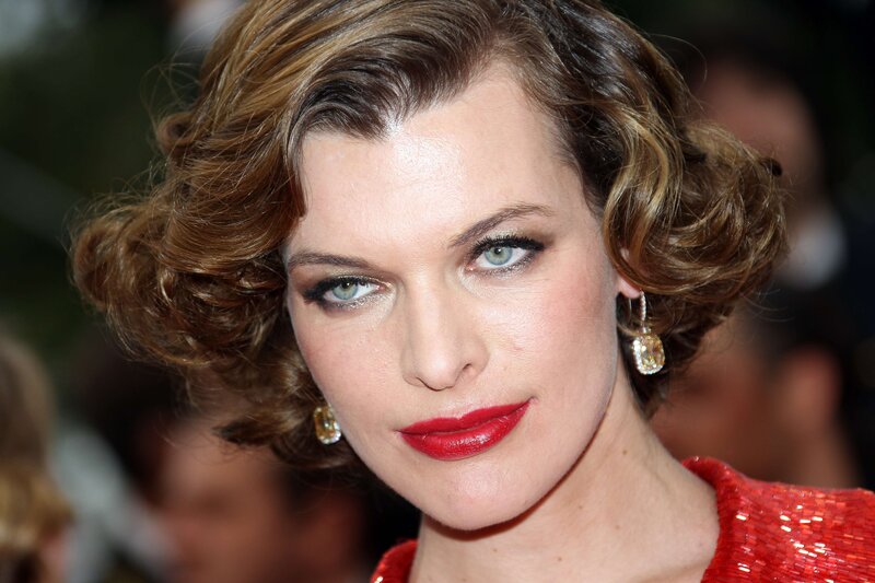 woman with red lipstick and curls