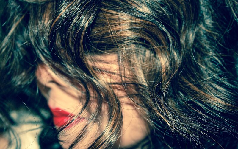 woman with red lipstick and dark hair