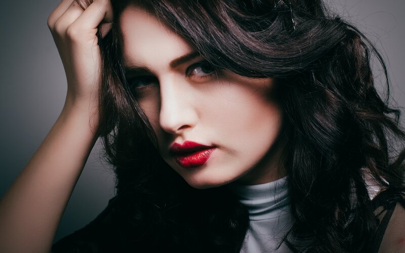 woman with red lipstick and dark hair