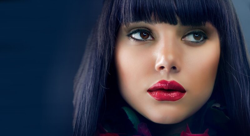woman with red lipstick and dark hair