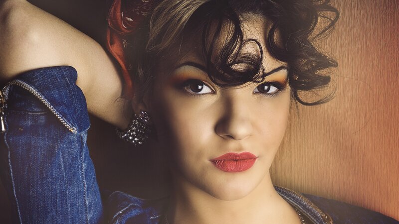 woman with red lipstick and denim jacket