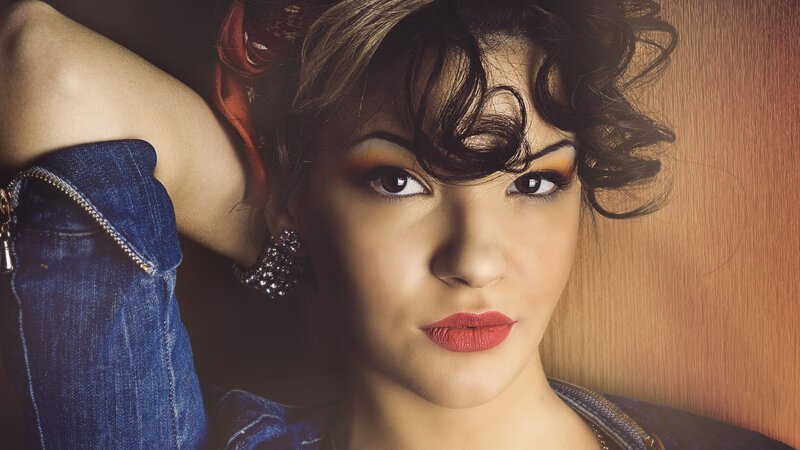 woman with red lipstick and denim jacket