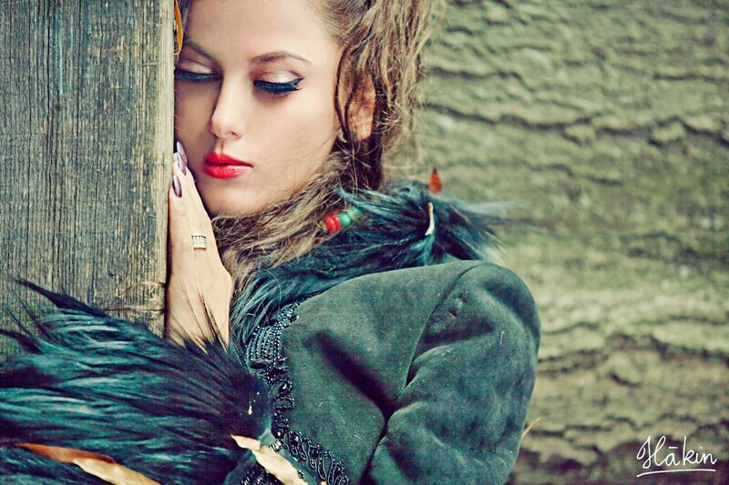 woman with red lipstick and feathered coat