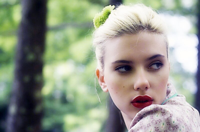 woman with red lipstick and flower