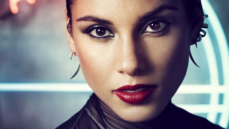 woman with red lipstick and futuristic earrings
