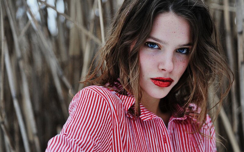 woman with red lipstick and glitter