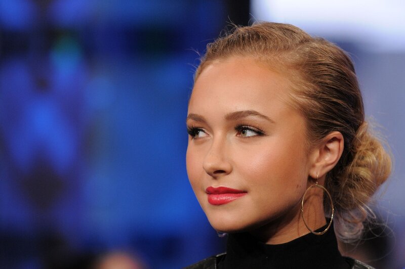woman with red lipstick and gold hoop earrings