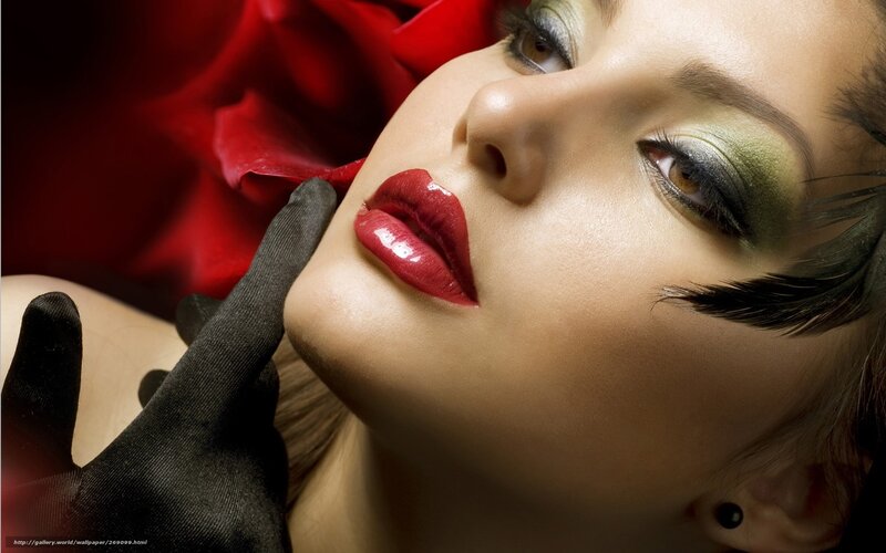 woman with red lipstick and green eyeshadow
