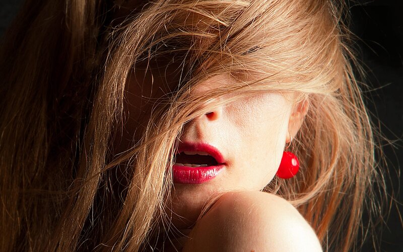 woman with red lipstick and hair