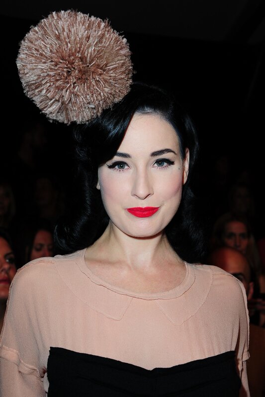 woman with red lipstick and hat