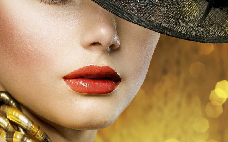 woman with red lipstick and hat