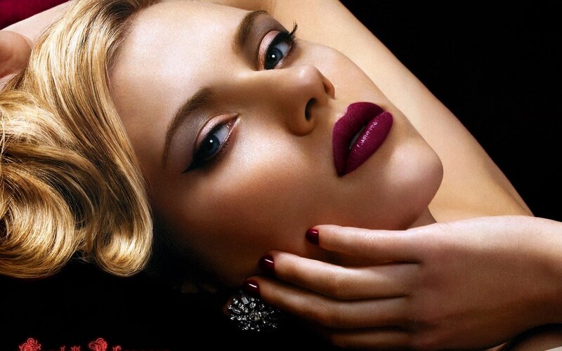 woman with red lipstick and makeup