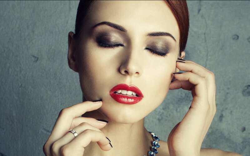 woman with red lipstick and makeup