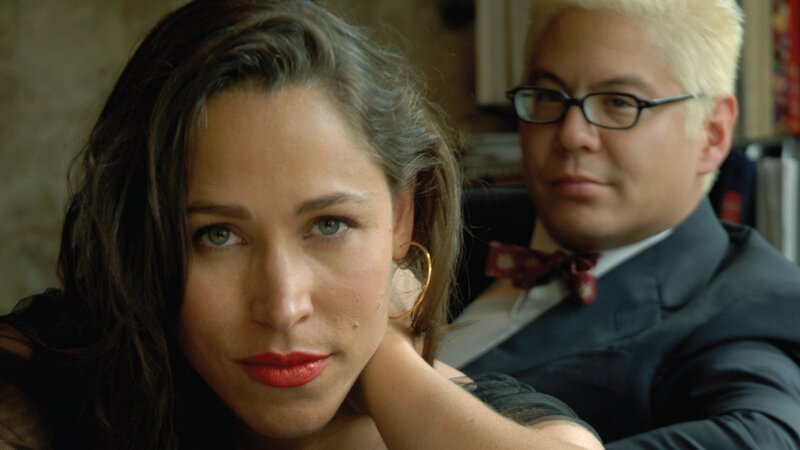 woman with red lipstick and man in suit