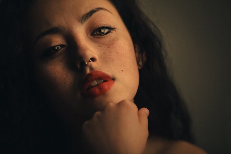 woman with red lipstick and nose ring