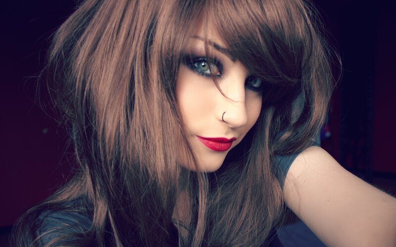 woman with red lipstick and nose ring