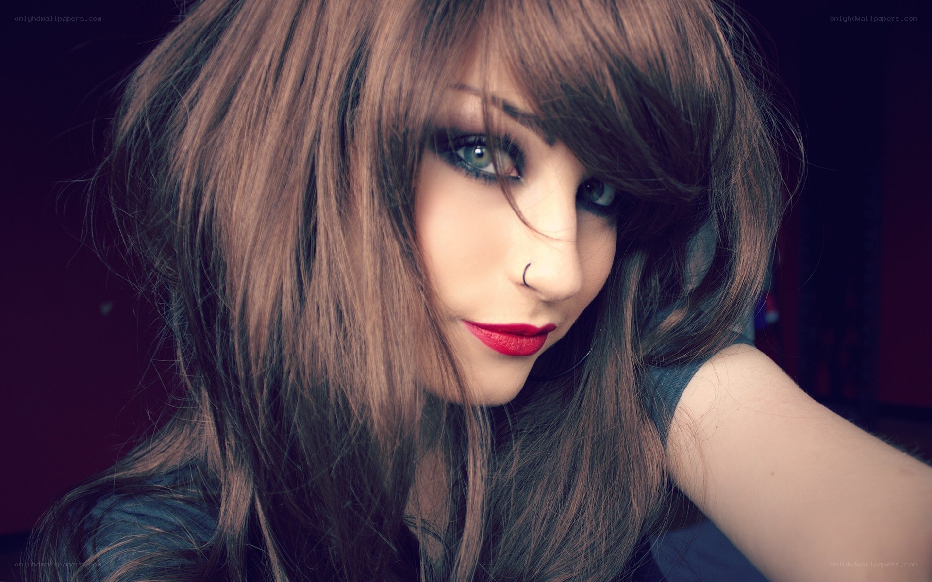 woman with red lipstick and nose ring