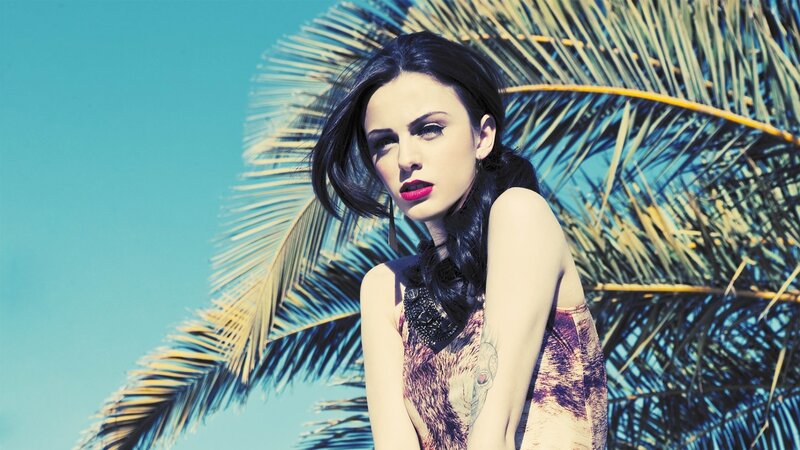 woman with red lipstick and palm tree