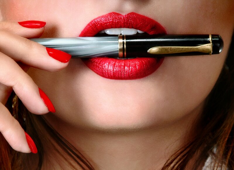 woman with red lipstick and pen