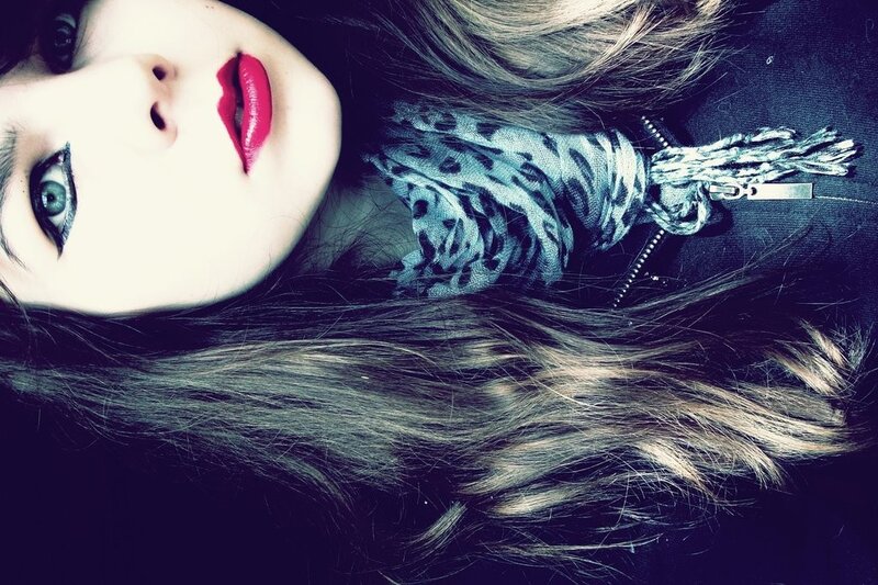 woman with red lipstick and scarf