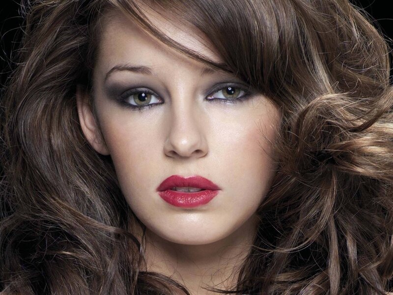woman with red lipstick and smoky eyes