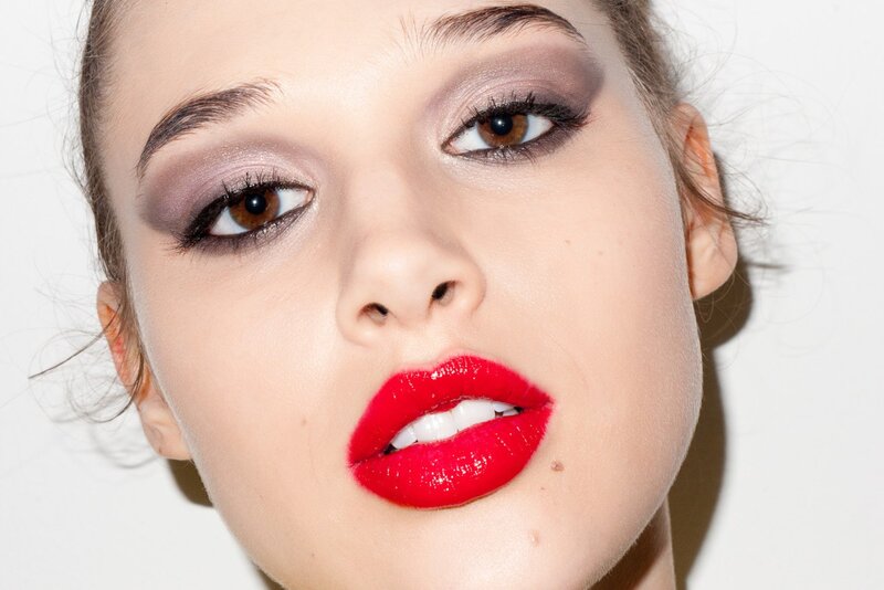 woman with red lipstick and smoky eyes