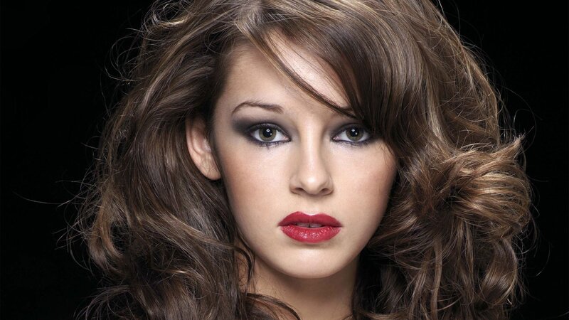 woman with red lipstick and smoky eyes