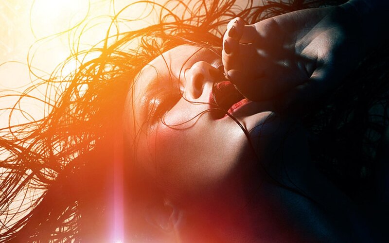 woman with red lipstick and sunlit hair